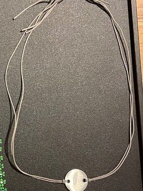 21" String choker with feather charm